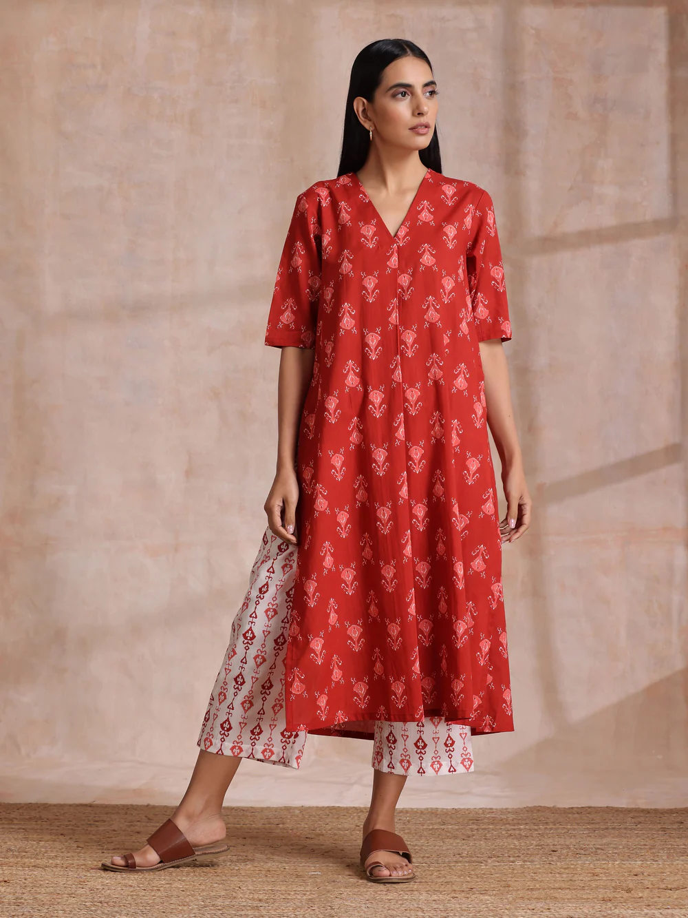 Women wearing TrueBrowns Red Ikat Print Cotton Kurta Pant Set