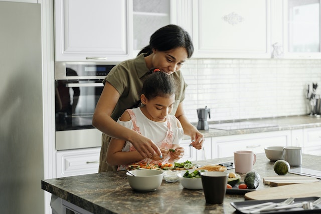 Child Preparing Meal for mother on Mother's Day