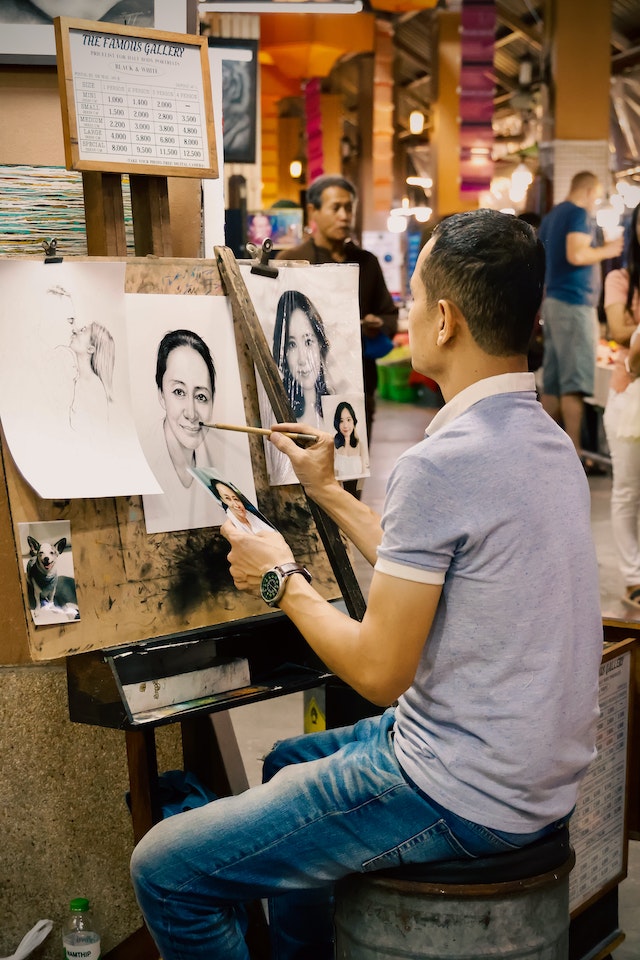 Man Drawing portrait of a woman